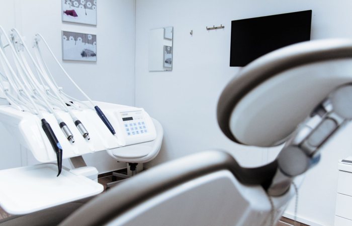 Bright dental office showcasing modern equipment and clean, sleek design.