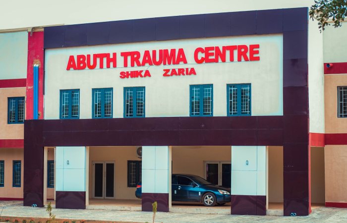 Front view of ABUTH Trauma Centre in Shika, Zaria, Nigeria. Modern medical facility architecture.