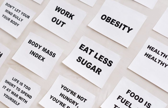 Collection of motivational notes promoting health and wellness found on paper notes.
